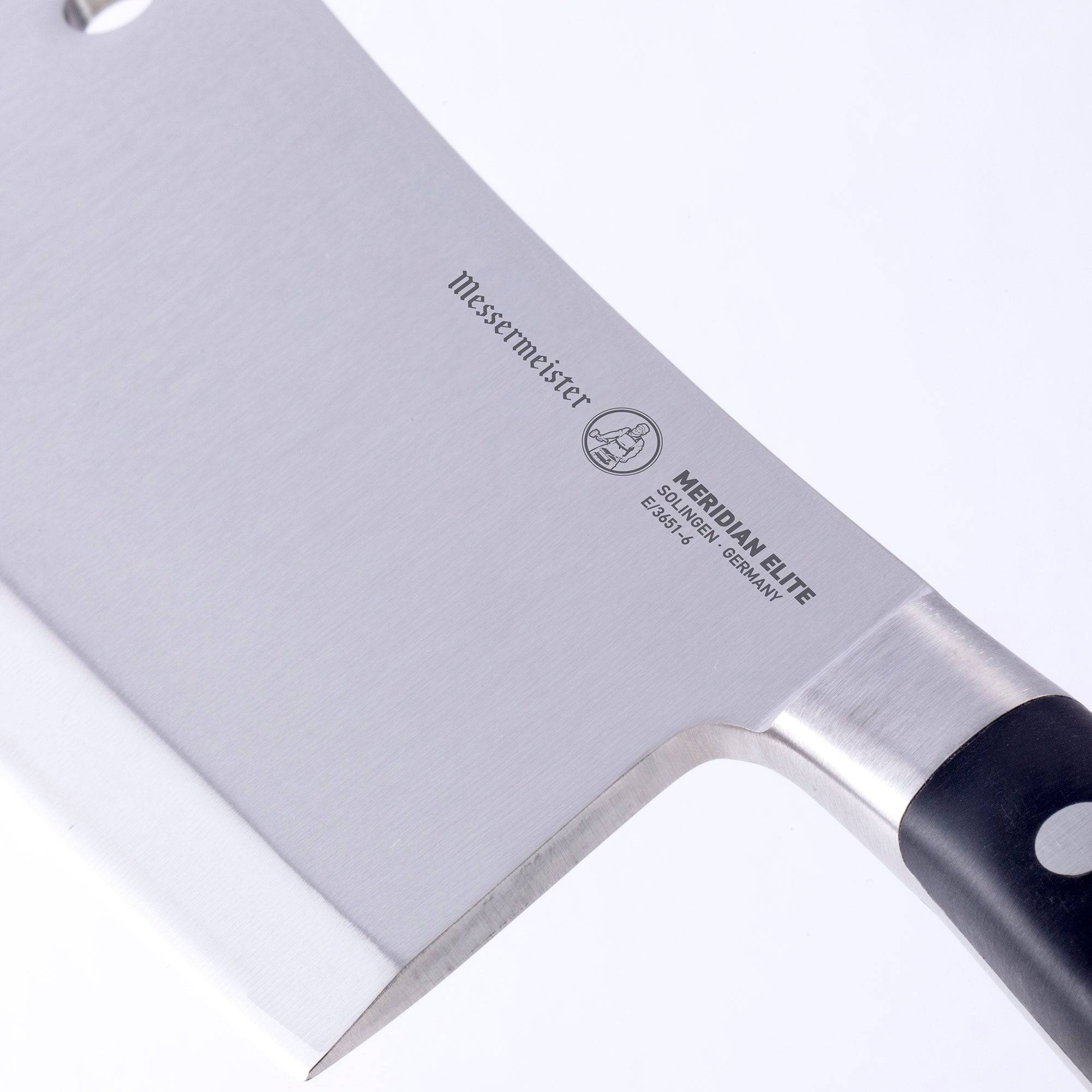 Close up view of the bolster and heel of the Meridian Elite 6 inch heavy cleaver showing bolster and blade thickness 