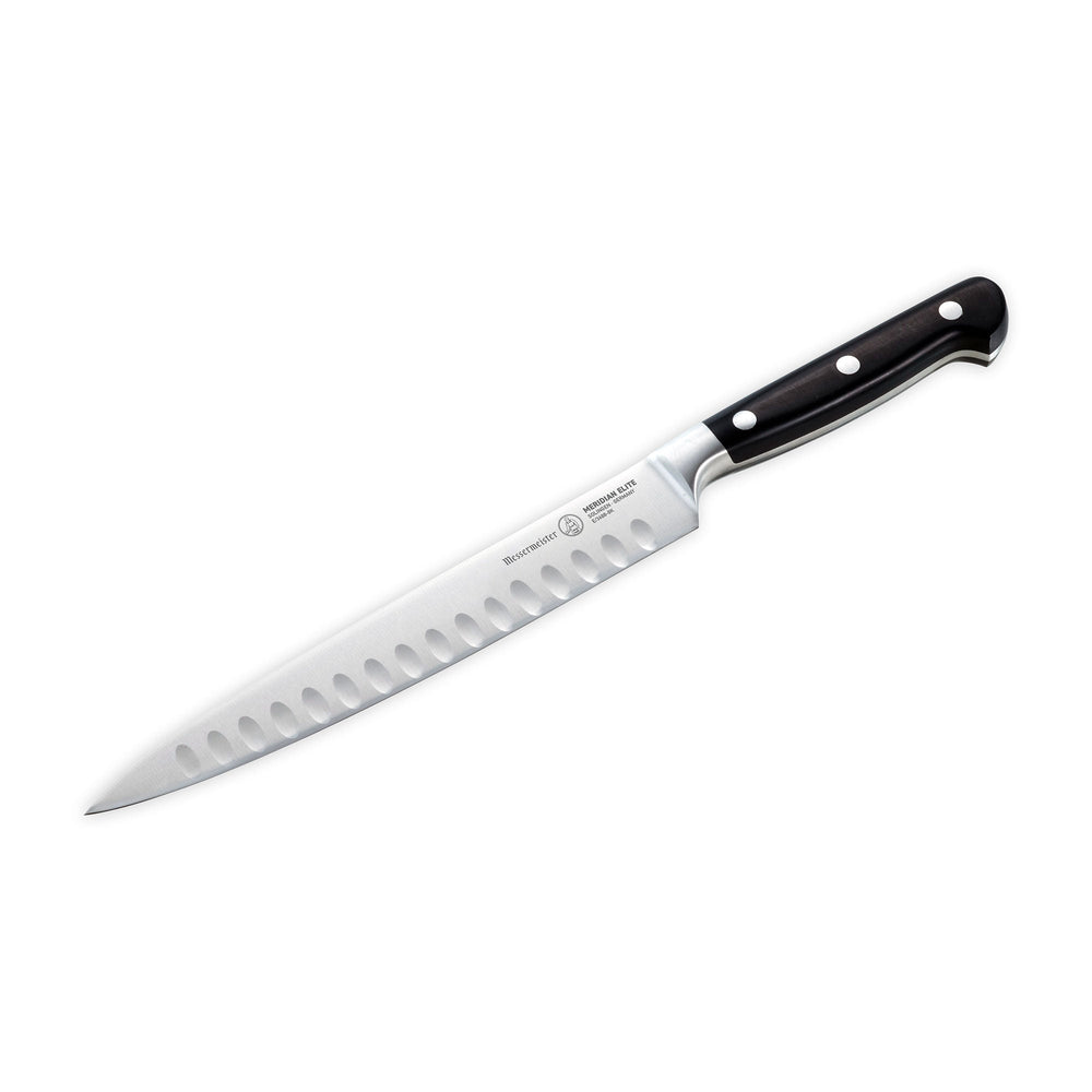 A 8 inch Meridian Elite Kullens carving knife with a narrow spearpoint, fine edge stainless steel blade and triple rivet black handle angled view pointing to lower left