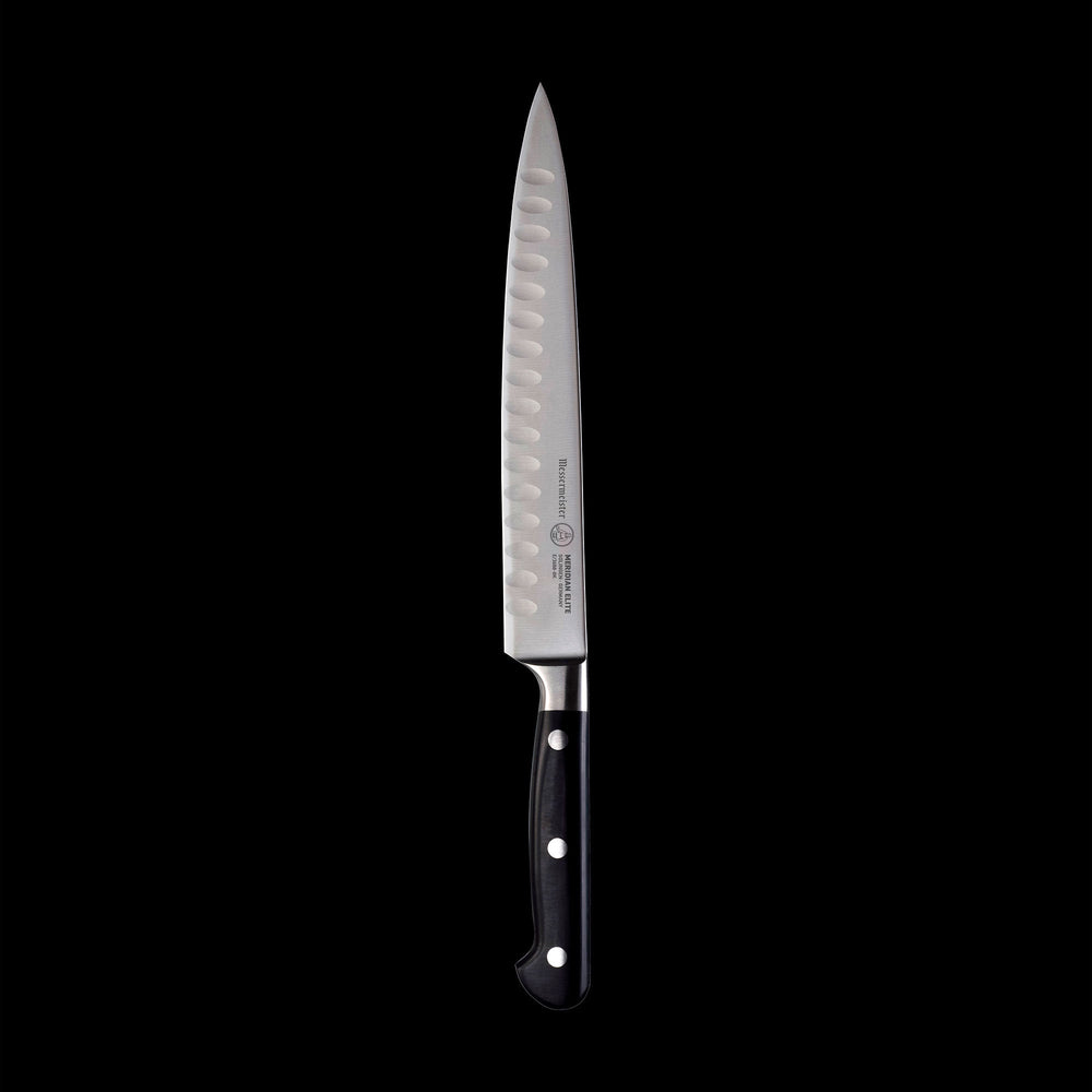 A 8 inch Meridian Elite Kullens carving knife with a narrow spearpoint, fine edge stainless steel blade and triple rivet black handle full view pointing up
