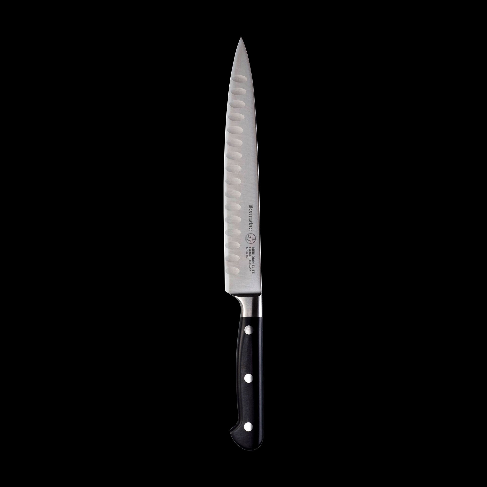A 8 inch Meridian Elite Kullens carving knife with a narrow spearpoint, fine edge stainless steel blade and triple rivet black handle full view pointing up