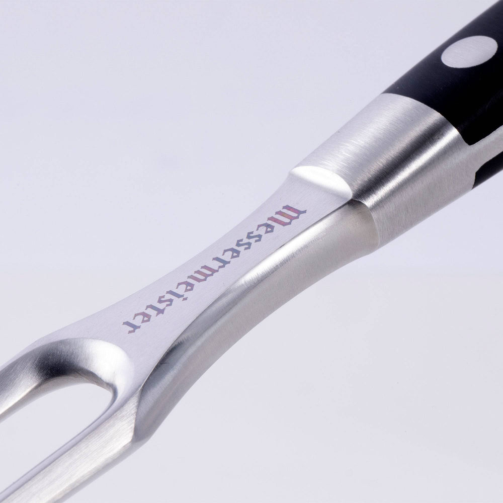 Messermeister Meridian Elite 6 inch Fork closeup view of logo on front of fork
