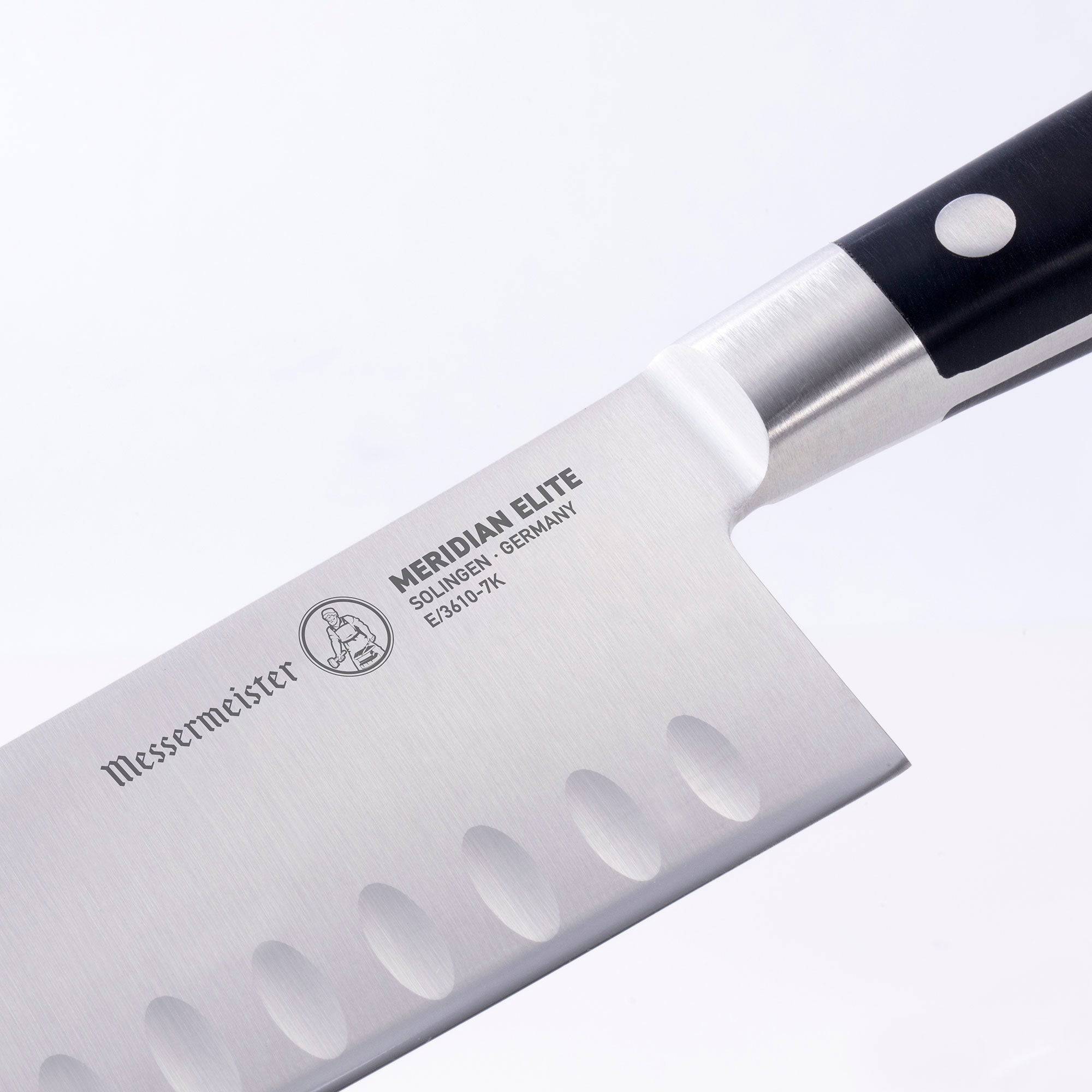 Close up of the bolster and heel of the 7 inch Meridian Elite Kullens Santoku showing logo