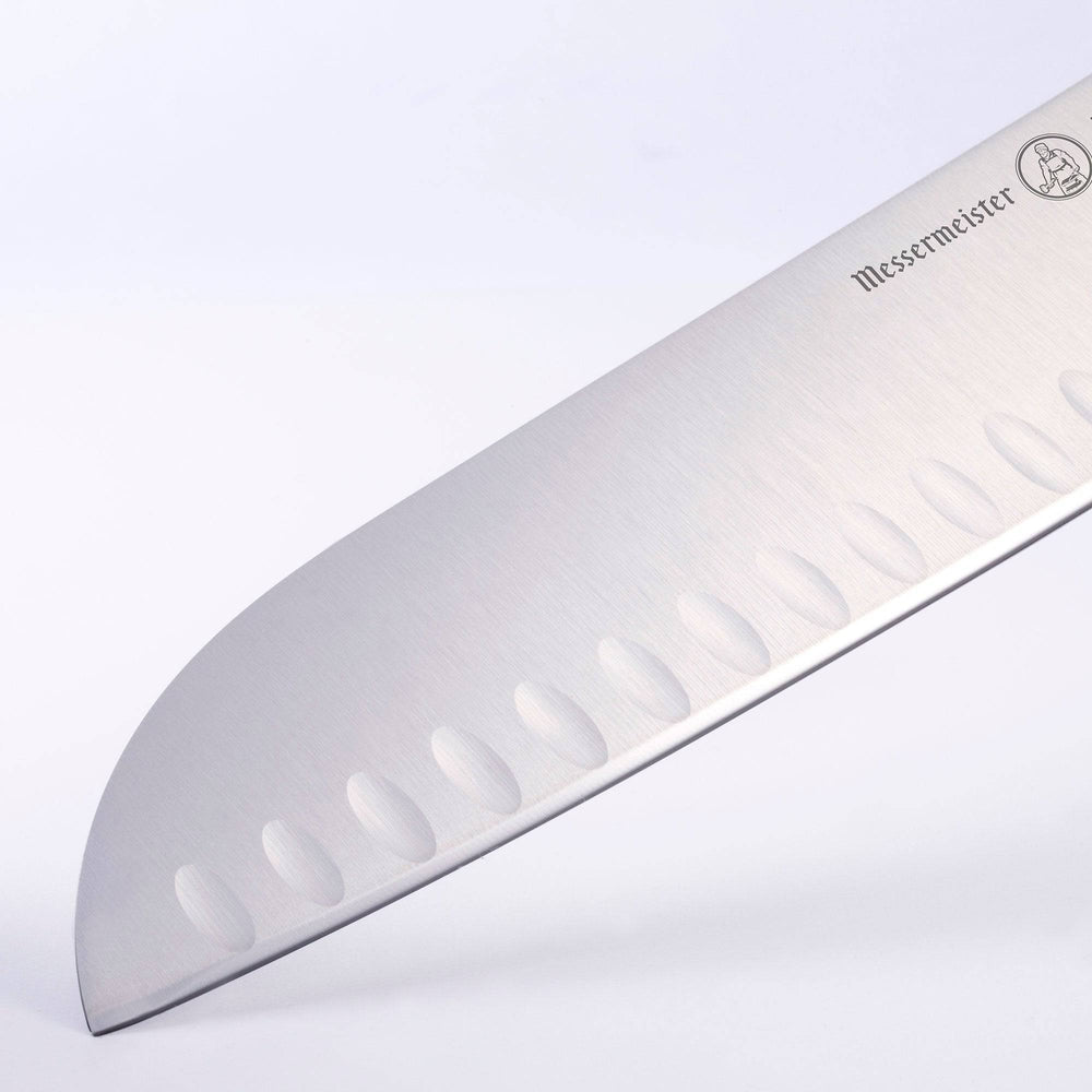 Close up of the tip and blade of the 7 inch Meridian Elite Kullens Santoku showing logo