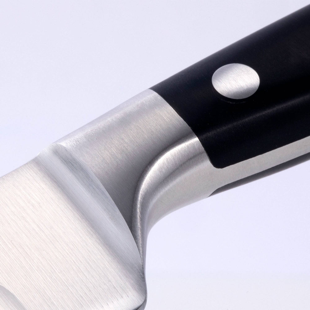 A close up of the 10 inch Meridian Elite Kullens carving knife showing the bolster and heel