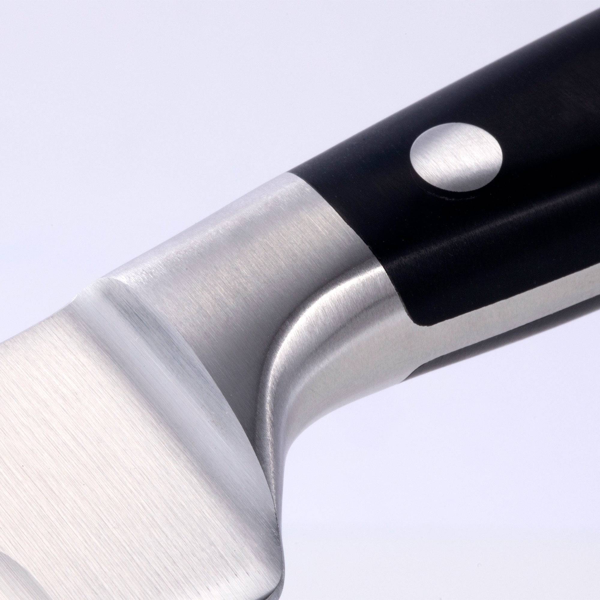 A close up of the 10 inch Meridian Elite Kullens carving knife showing the bolster and heel