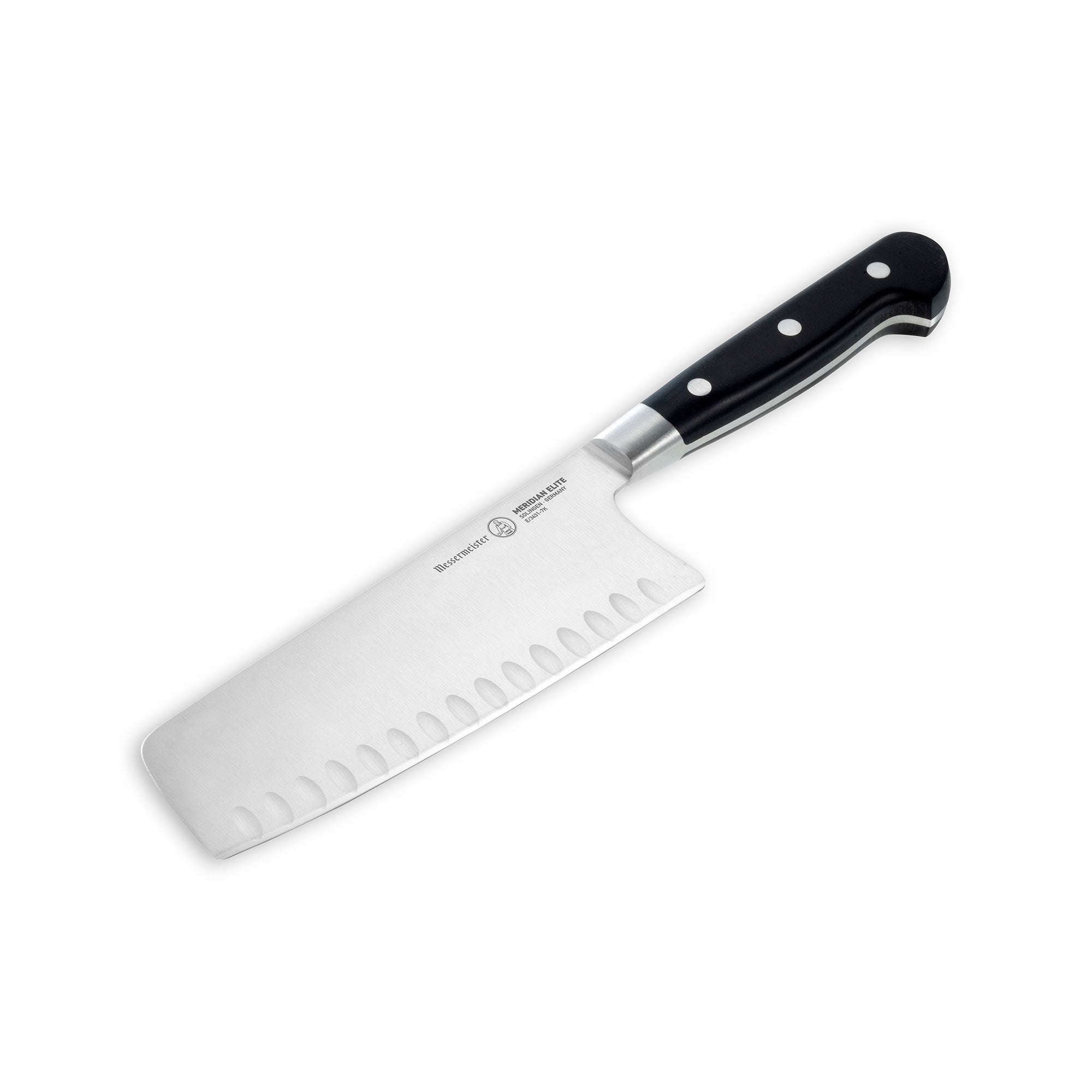 Angled view of the Messermeister Meridian Elite 7 inch Kullens Vegetable Knife featuring a silver blade with kullens on the side and a triple rivet black handle.