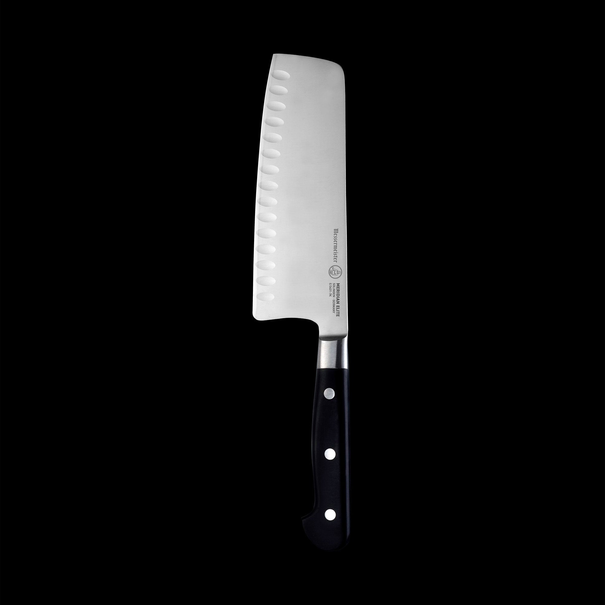 Vertical view of the Meridian Elite 7 inch Kullens Vegetable Knife featuring a silver blade with kullens on the side and a triple rivet black handle.