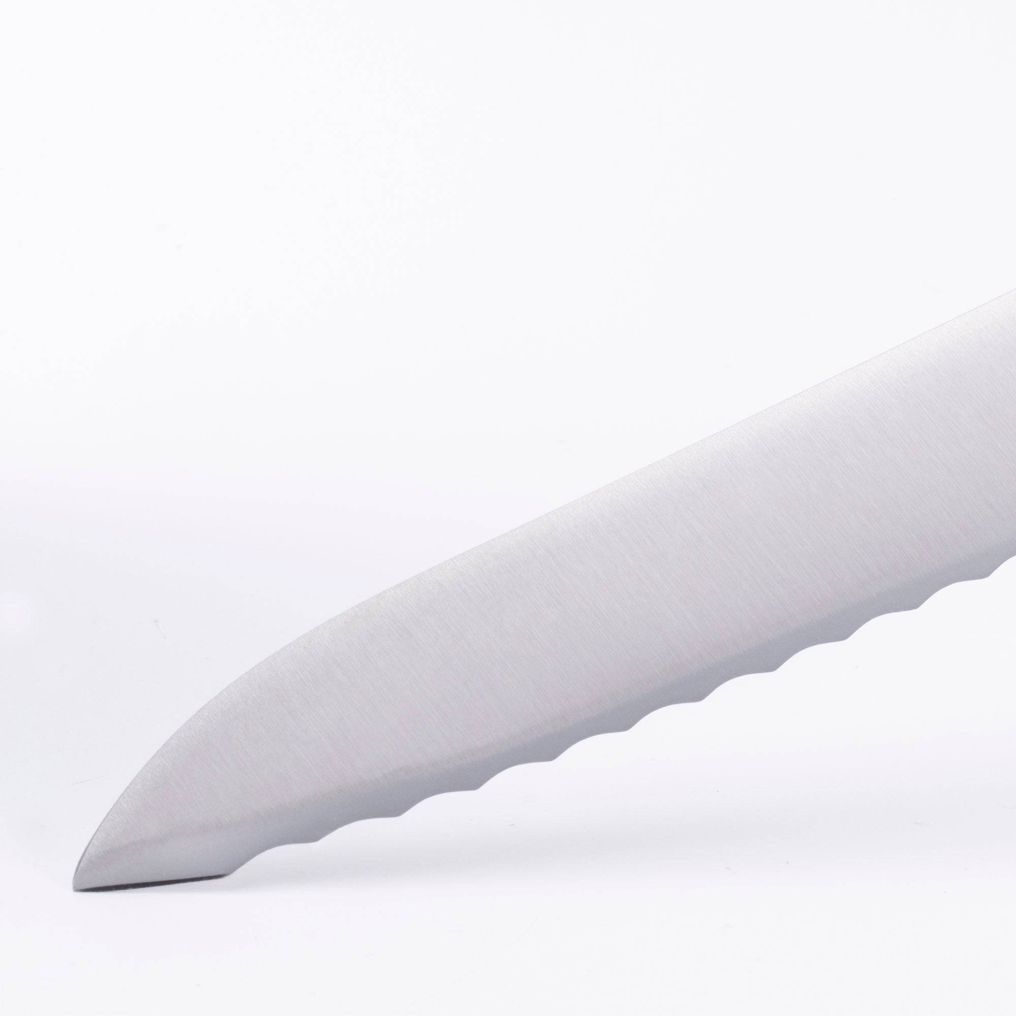 Close of view of the tip of the 8 inch Meridian Elite Offset Scalloped Bread Knife showing scallops 