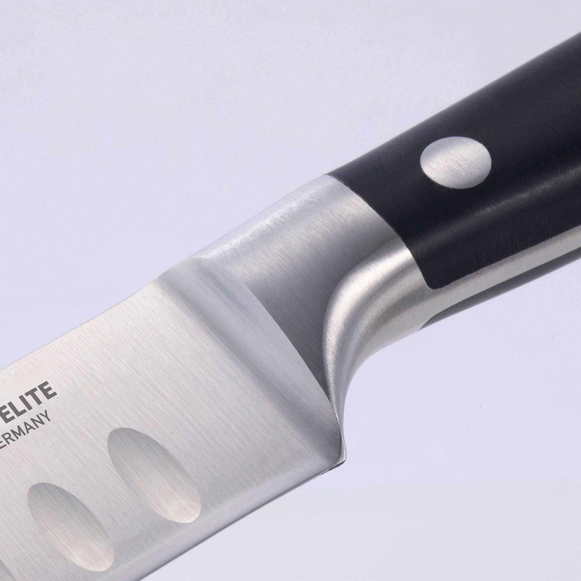 A close up view of the bolster and heel of the 10 inch Messermeister Meridian Elite Round Tip Kullens Slicer 