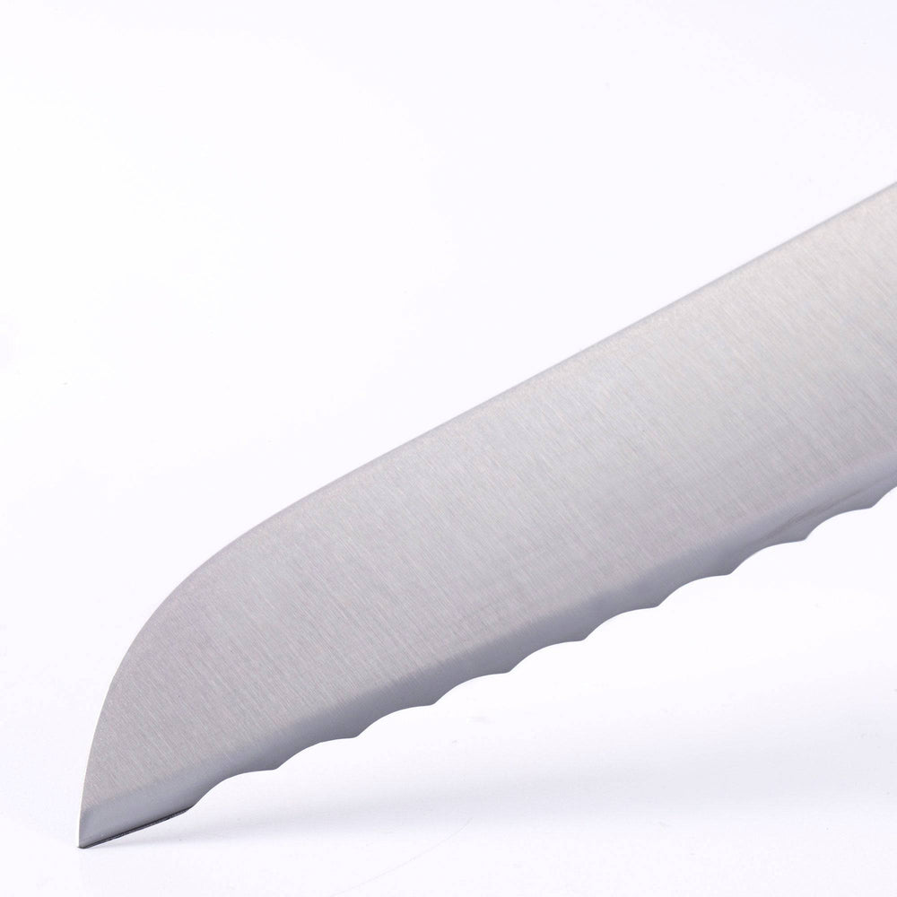 Close up view of the Meridian Elite 9 inch serrated bread knife tip showing serration 