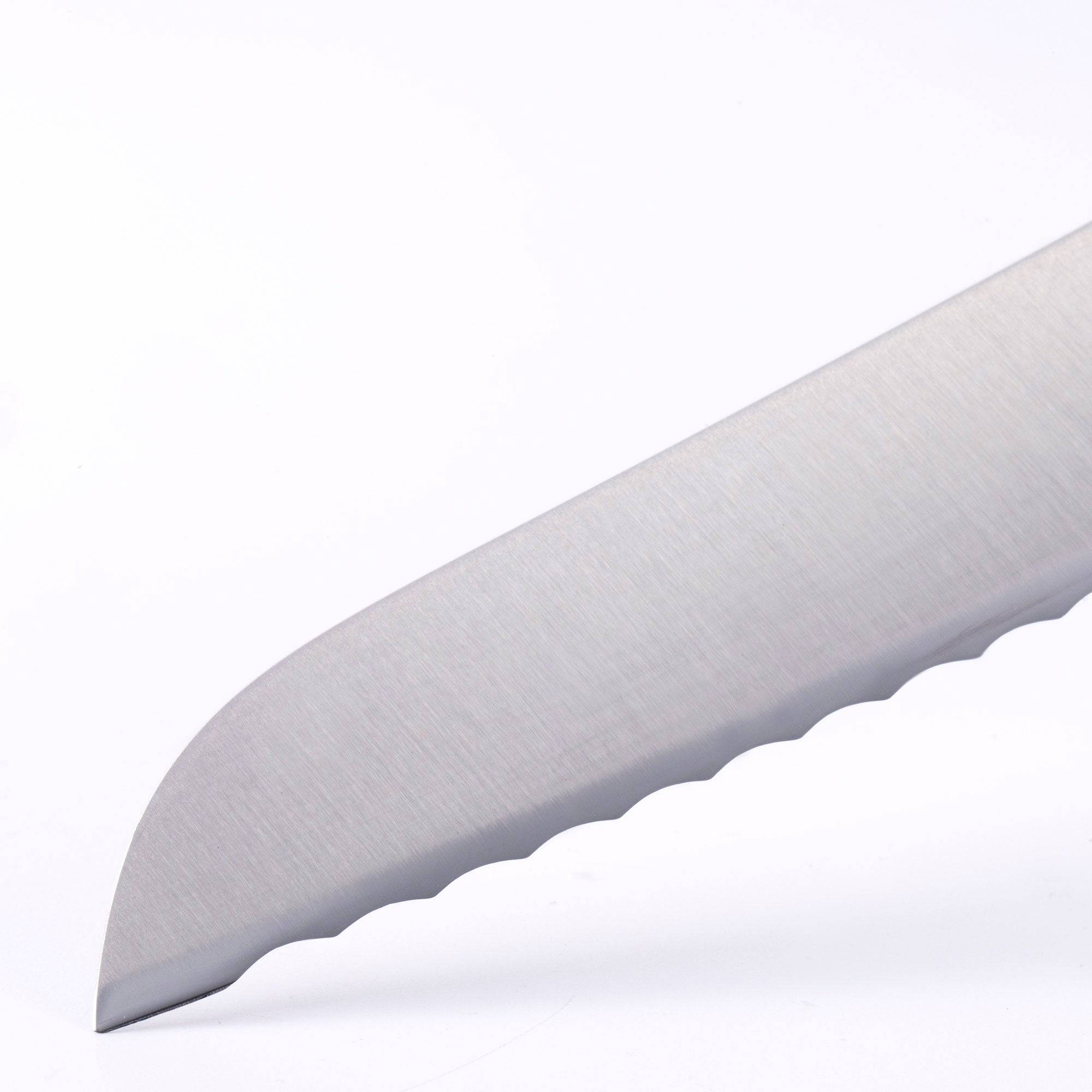 Close up view of the Meridian Elite 9 inch serrated bread knife tip showing serration 