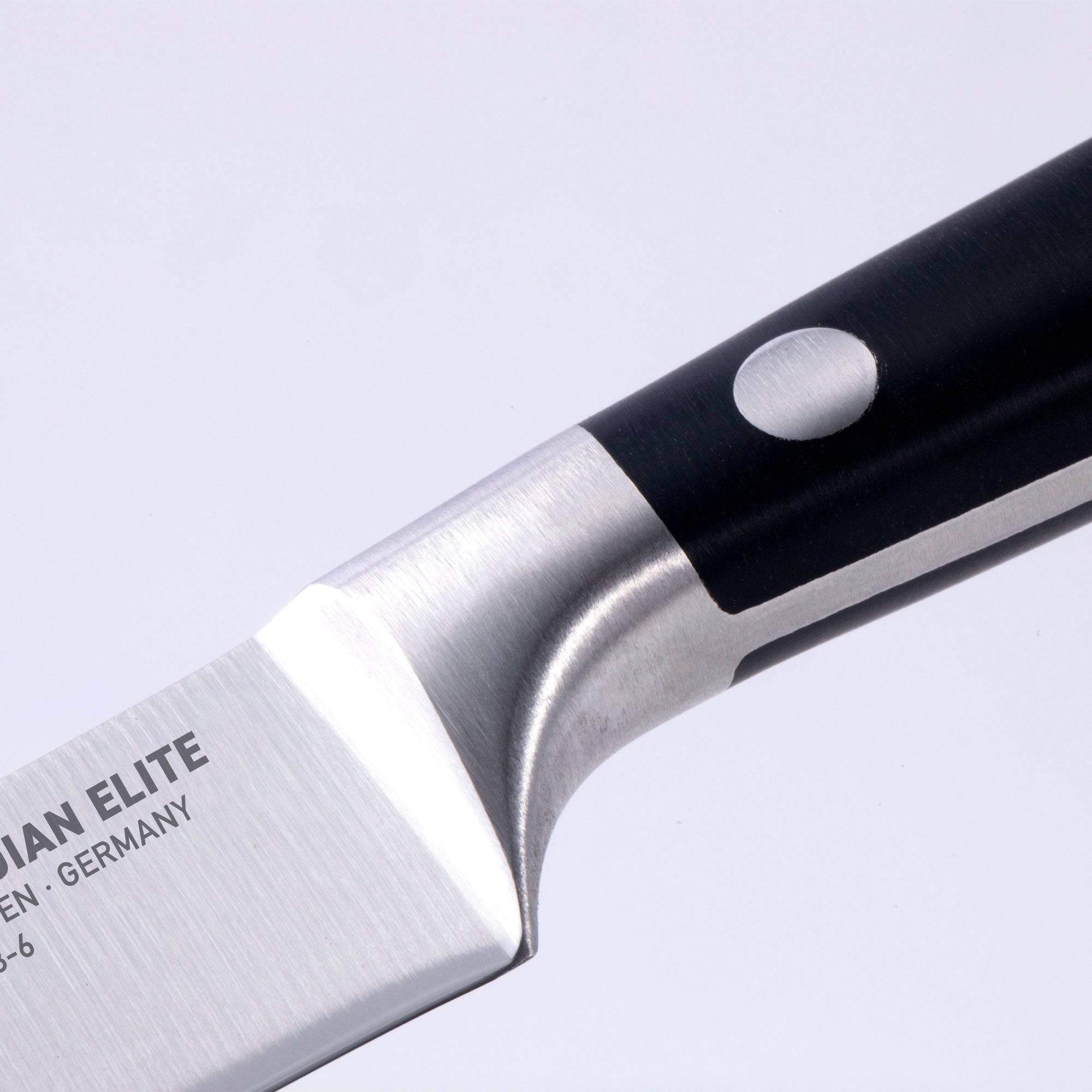 Messermeister Meridian Elite 6 inch Utility Knife close up view of logo, bolster and heel