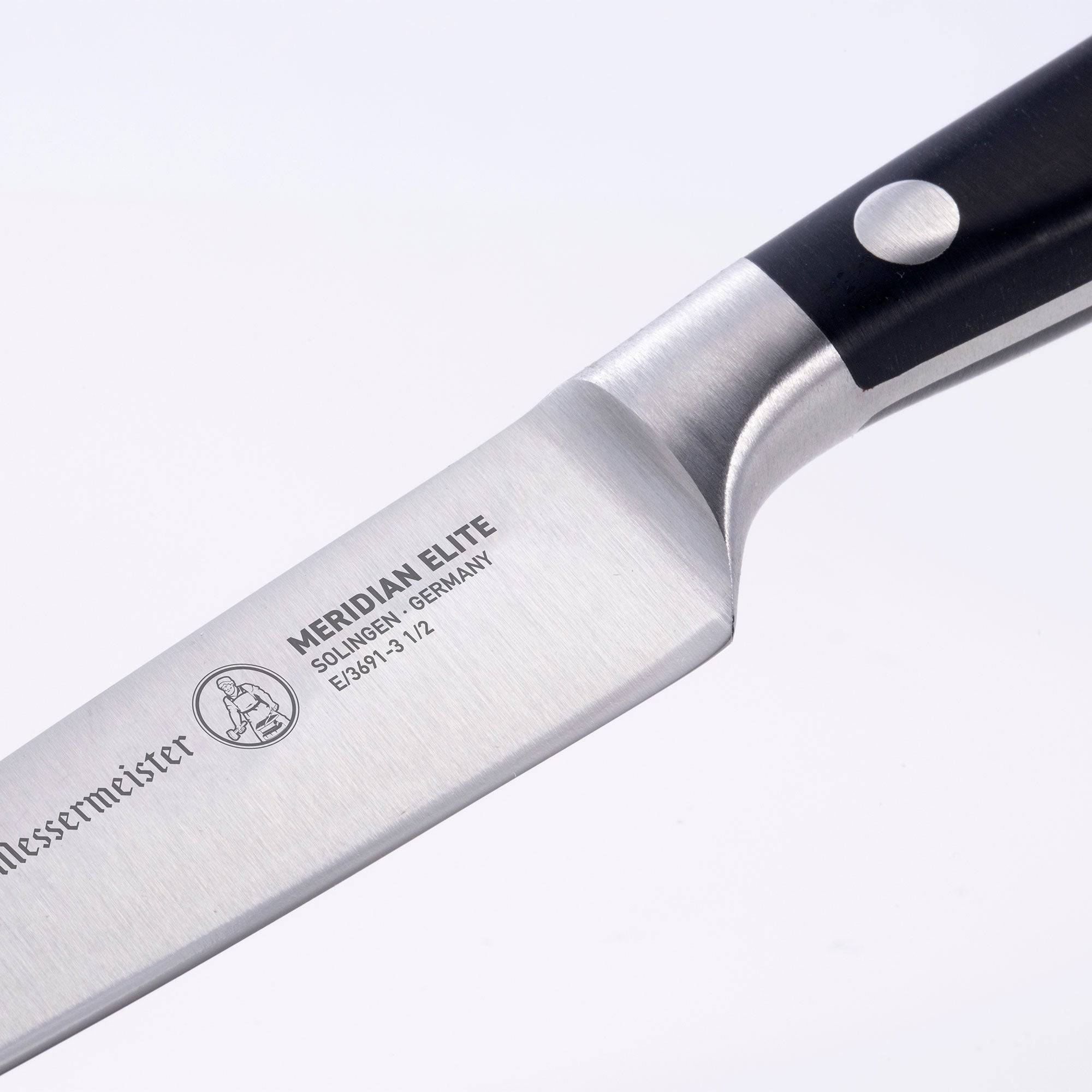 Messermeister Meridian Elite 3.5 inch paring knife close up view of bolster and heel with logo