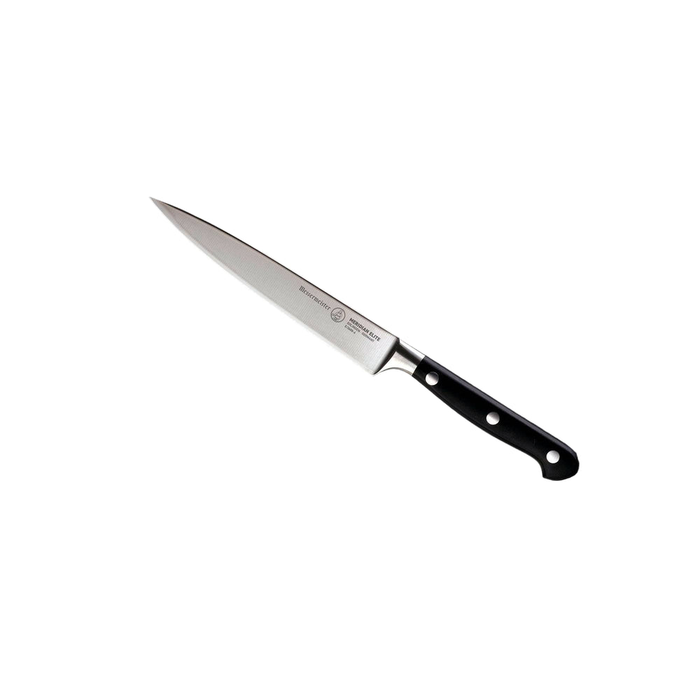 A 6 inch Messermeister Meridian Elite Utility Knife with a silver stainless steel blade and triple rivet black handle angled view pointing to upper left