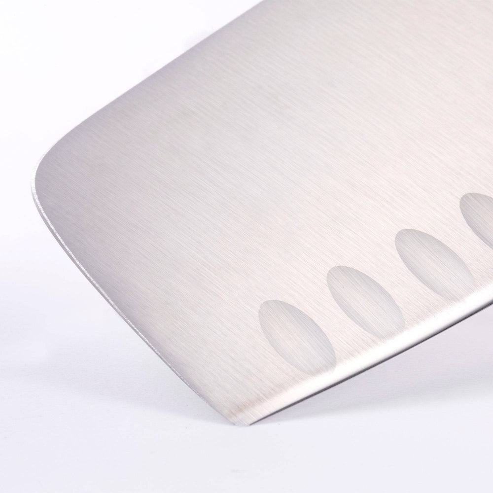 Close up of the tip and kullens of the Meridian Elite 7 inch Kullens Vegetable Knife 