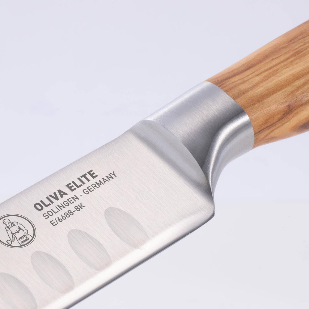 A close up of the 8 inch Oliva Elite Kullens carving knife showing the bolster and heel