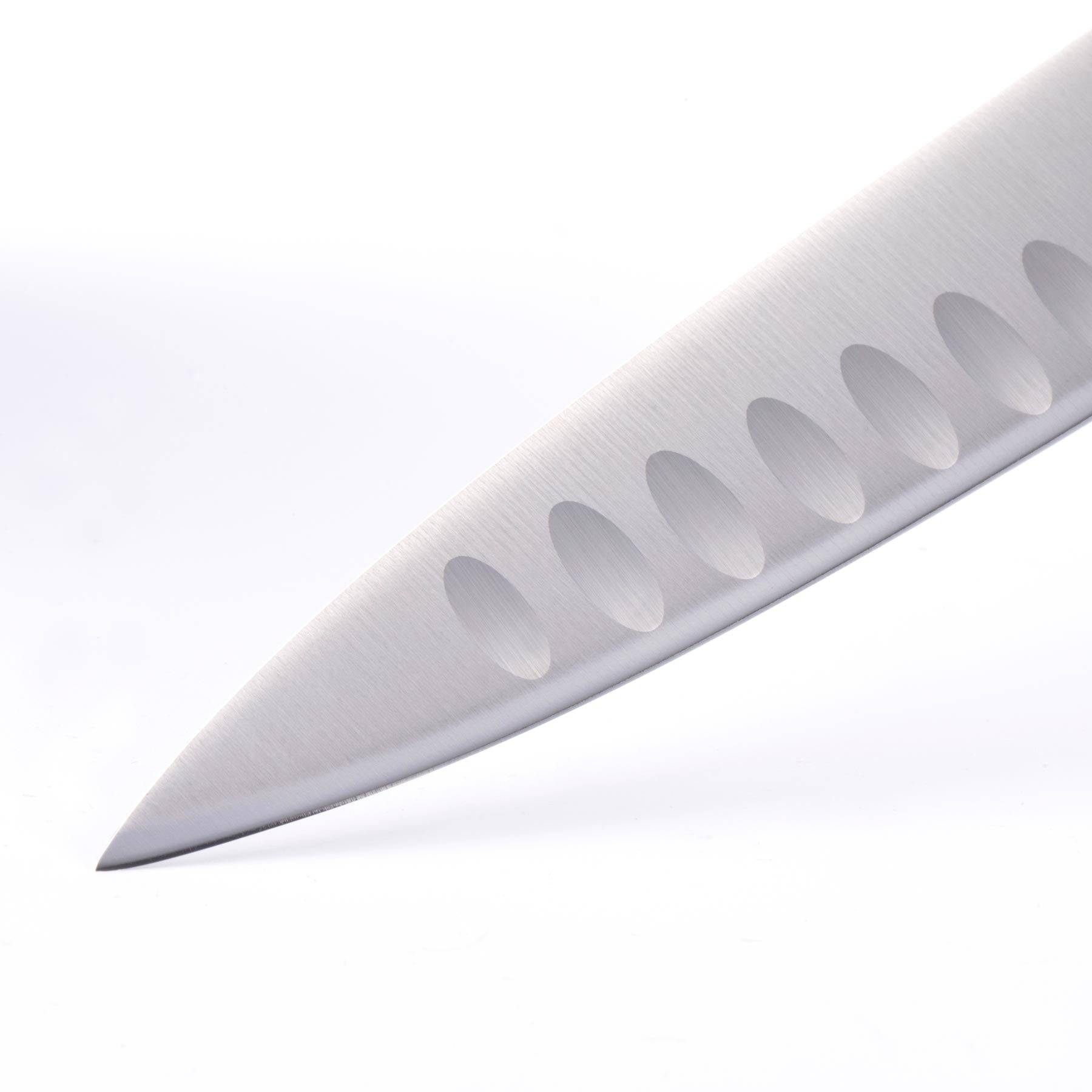 A close up of the 8 inch Oliva Elite Kullens carving knife showing the kullens and narrow spearpoint tip