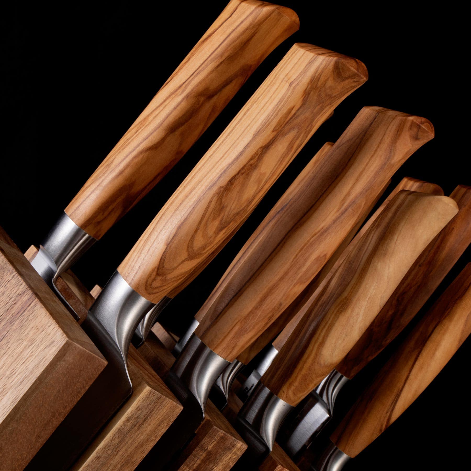 Close up view of the olive wood handles on the Oliva Elite 11 Piece Next Level Block Set 