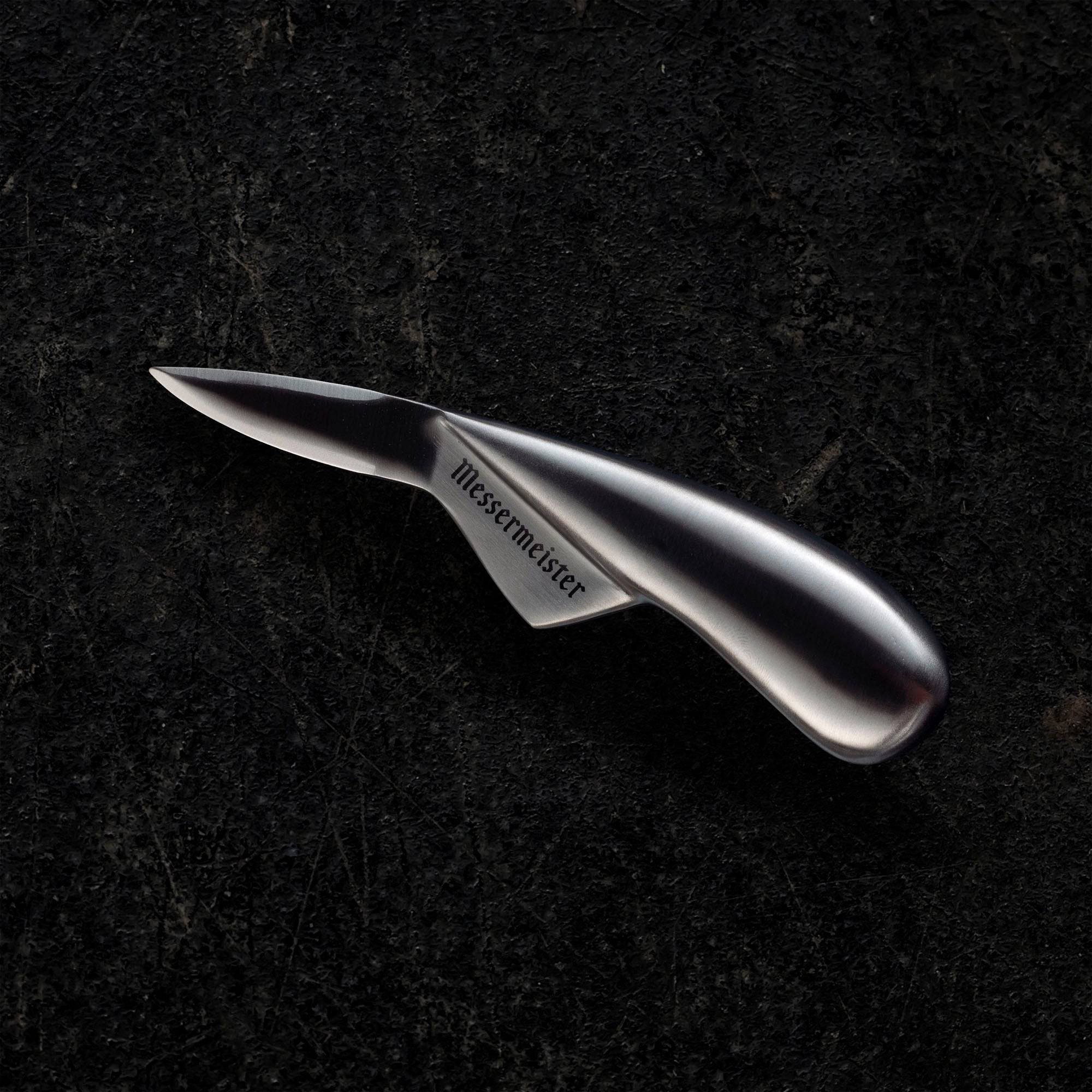 Side view of the Messermeister 6.5-inch oyster knife featuring a narrow stainless steel blade and ergonomic handle designed for precise oyster shucking
