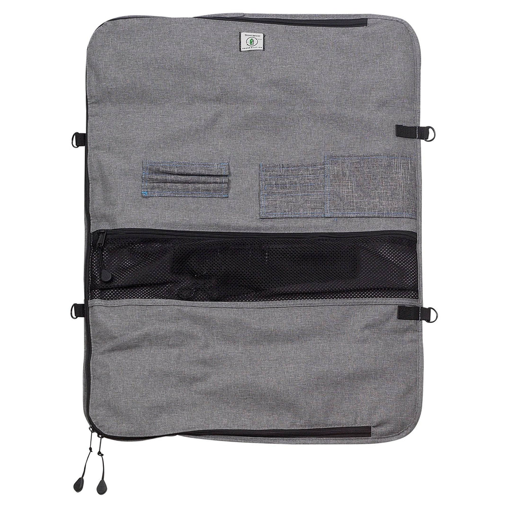 Inside view of Messermeister Preservation 12-pocket knife bag showing padded interior with elastic knife slots, zippered storage compartments, and organized chef knife storage design in gray recycled fabric