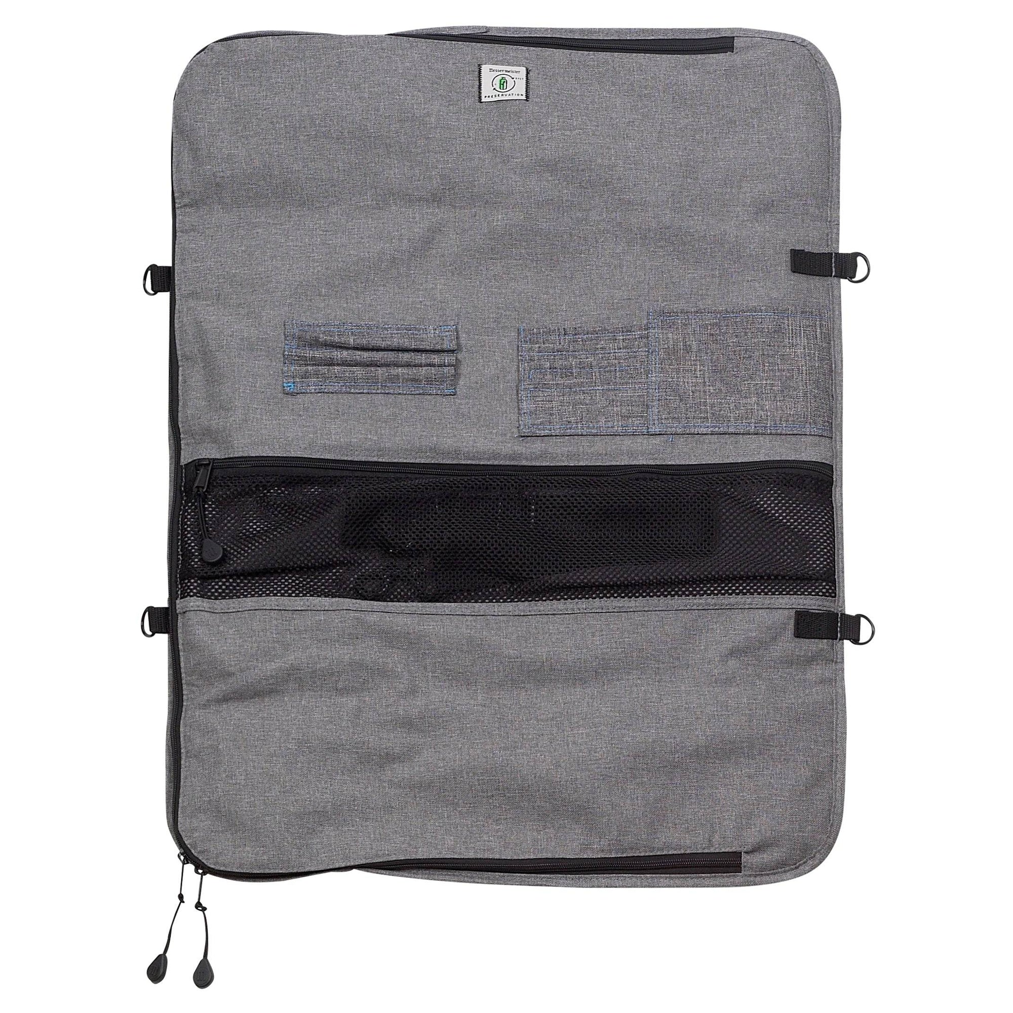 Inside view of Messermeister Preservation 12-pocket knife bag showing padded interior with elastic knife slots, zippered storage compartments, and organized chef knife storage design in gray recycled fabric