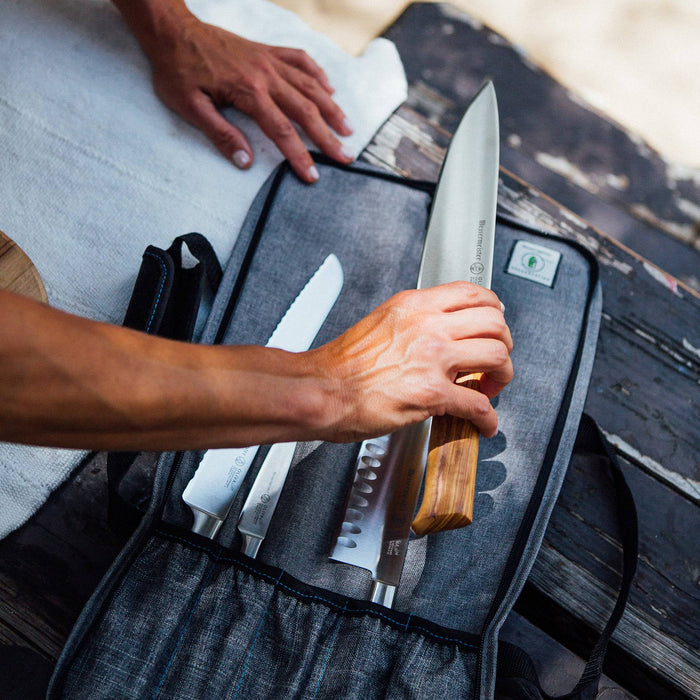 Messermeister Preservation 5 Pocket Knife Bag in gray, featuring durable padded exterior with five secure knife pockets, zippered storage compartments, reinforced handles, and a compact, professional design for safely organizing and transporting chef knives and culinary tools