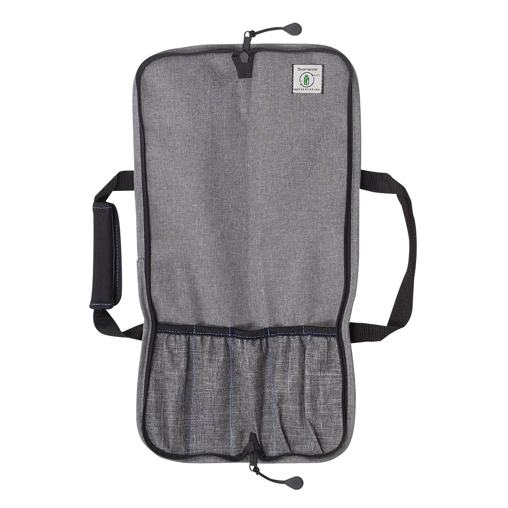 Interior view of the Messermeister Preservation 5 Pocket Knife Bag in gray, fully opened to reveal five padded knife pockets, interior zippered storage compartment, durable protective lining, and organized layout designed for safely storing and transporting chef knives and culinary tools