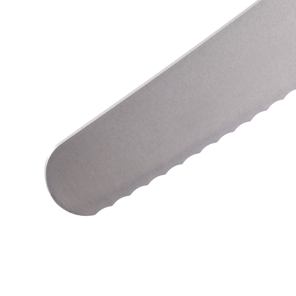 Close-up view of pointed tip on Messermeister Pro Series 10-inch scalloped baker’s knife showing serrated edge for controlled slicing