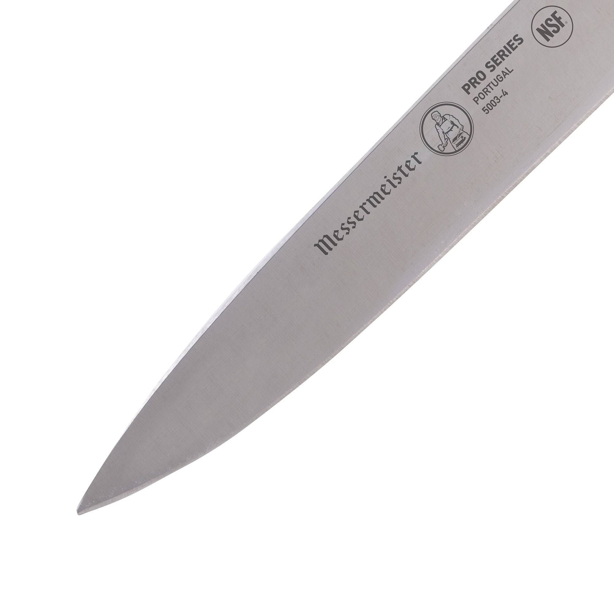 Close-up of the tip and blade of the Messermeister Pro Series 4-inch spear point paring knife showing sharp stainless steel edge for precision cutting