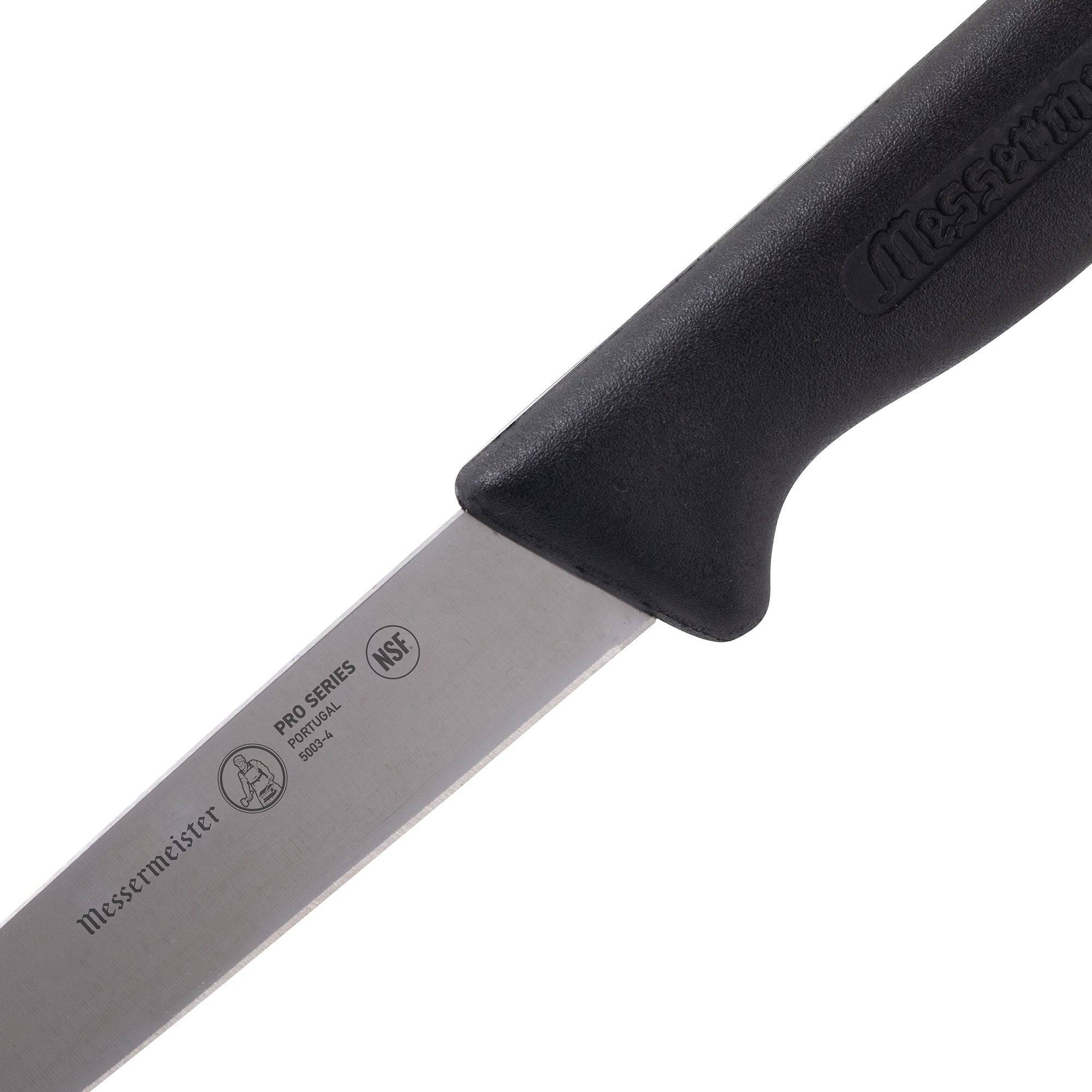 Detail of heel section on Messermeister Pro Series 4-inch spear point paring knife highlighting stainless steel blade base and ergonomic non-slip black polyfibre handle connection