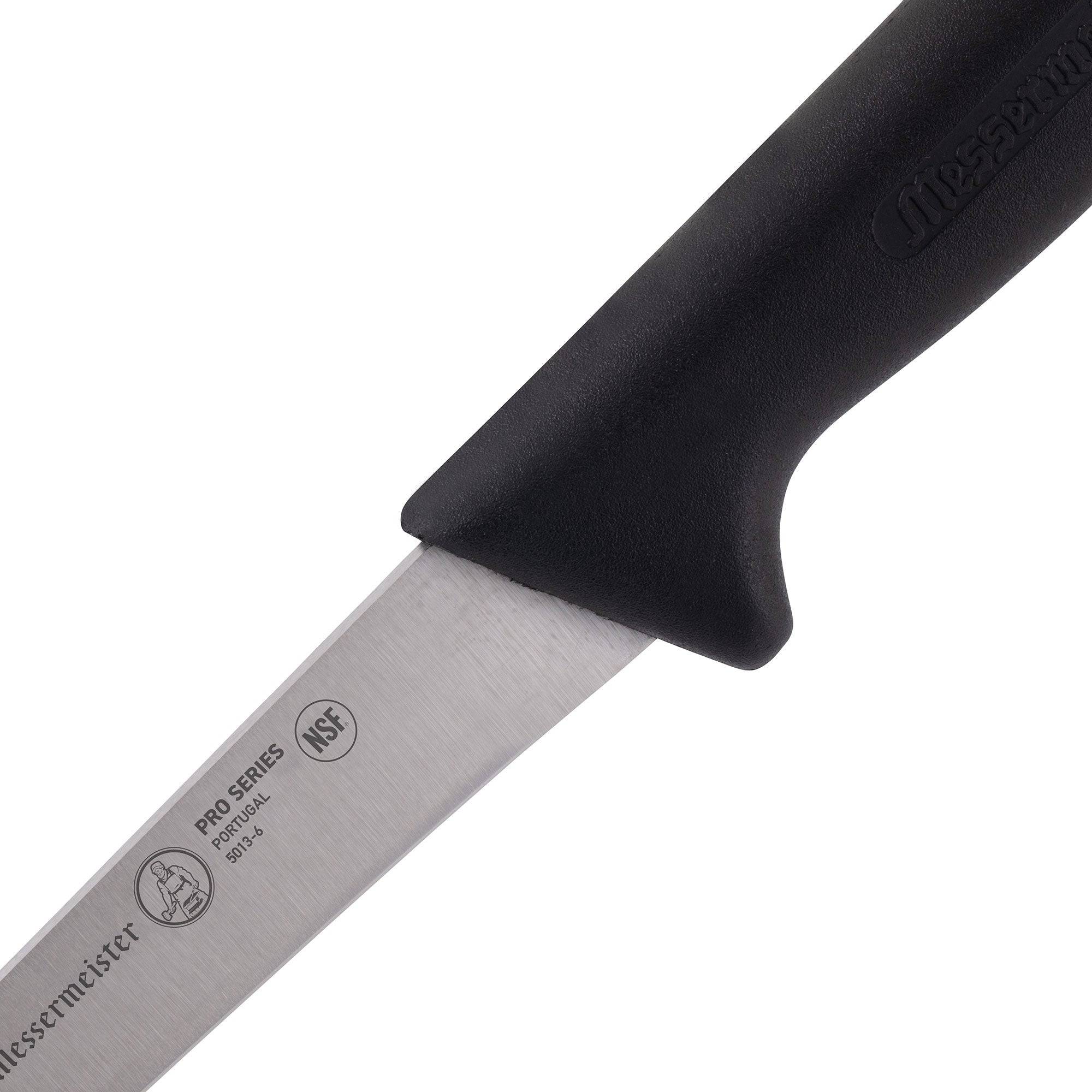 Close-up of the heel of the Messermeister Pro Series 6-inch stiff boning knife showing rigid stainless steel blade and ergonomic black polyfibre handle connection