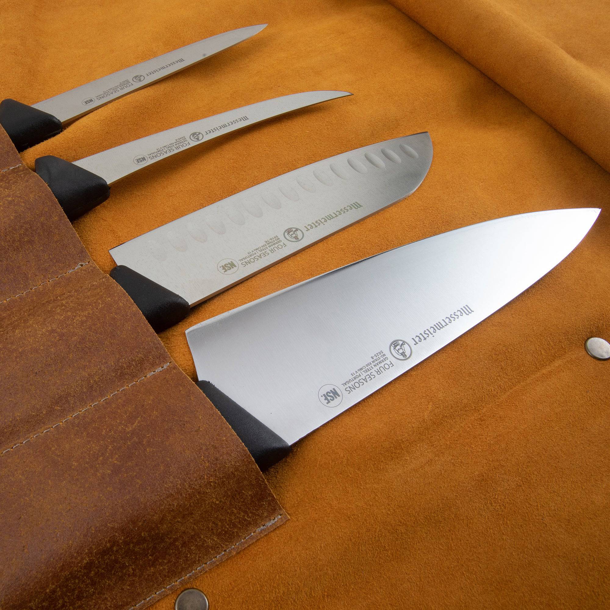 Close-up of the interior pockets on the Messermeister Vintage Leather 7 Pocket Knife Roll in amber brown, showcasing individual knife compartments with durable canvas lining, reinforced stitching, protective flaps, and organized storage for chef knives and culinary tools