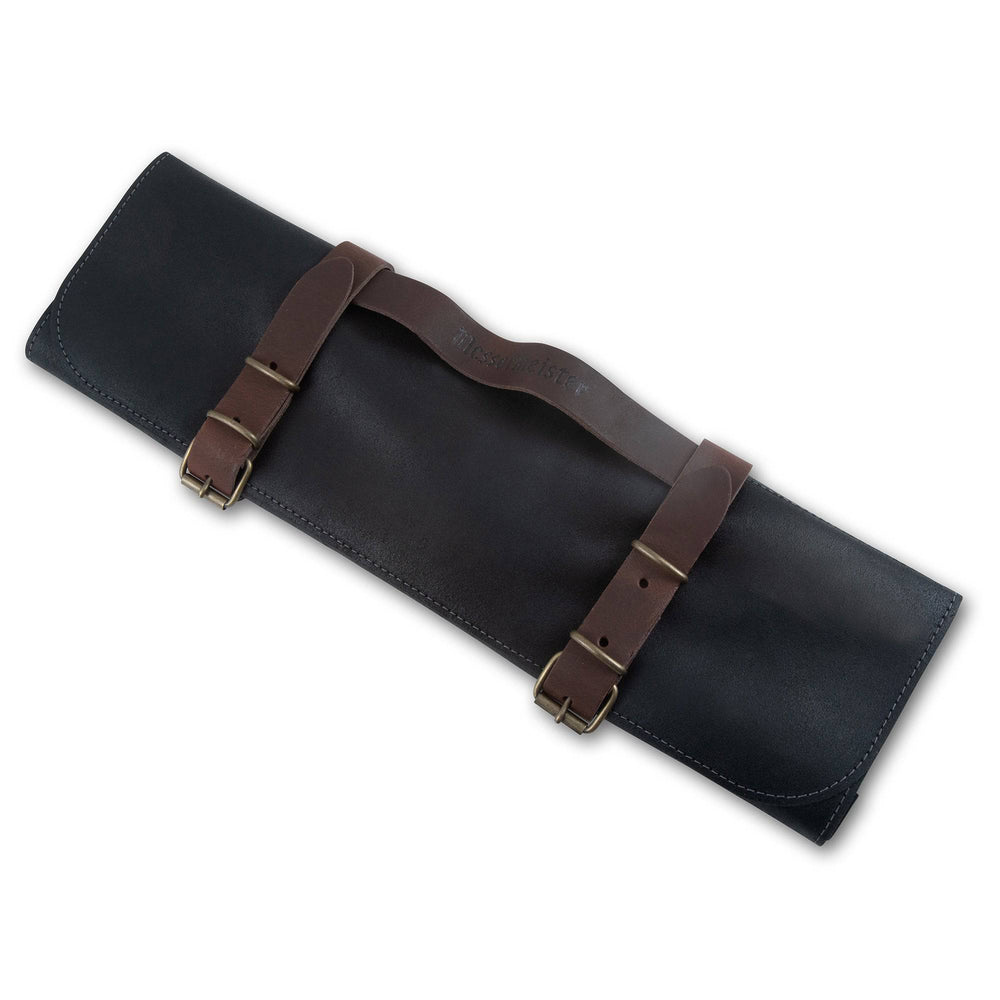 Close-up of the Messermeister Vintage Leather 7 Pocket Knife Roll in black, highlighting the premium full-grain leather texture, handcrafted stitching, embossed logo detailing, and durable construction designed for professional chef knife storage and transport