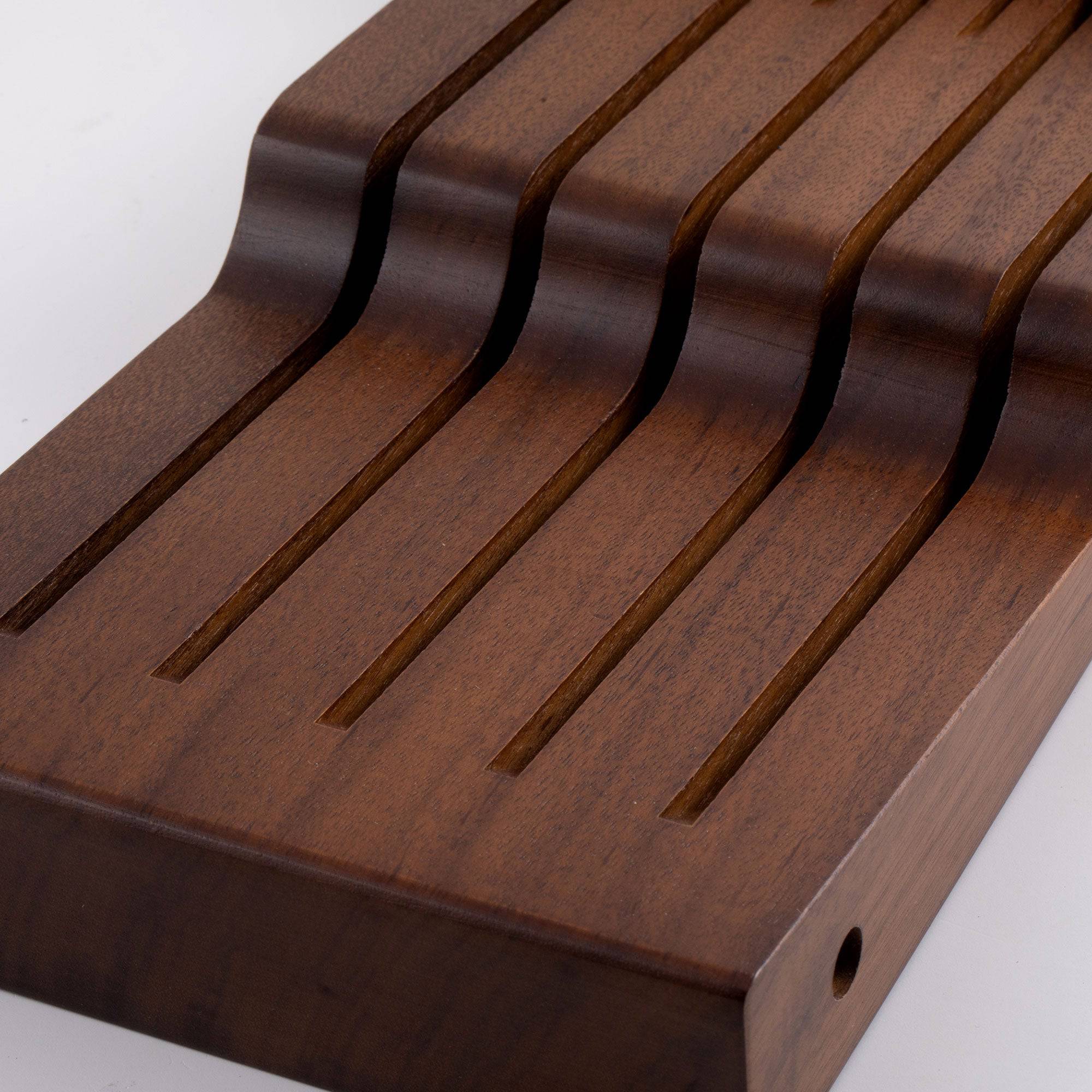 Messermeister 11 Slot Contemporary Acacia In-Drawer Knife Holder shows a close up of the bottom layer of the holder and 5 slots.