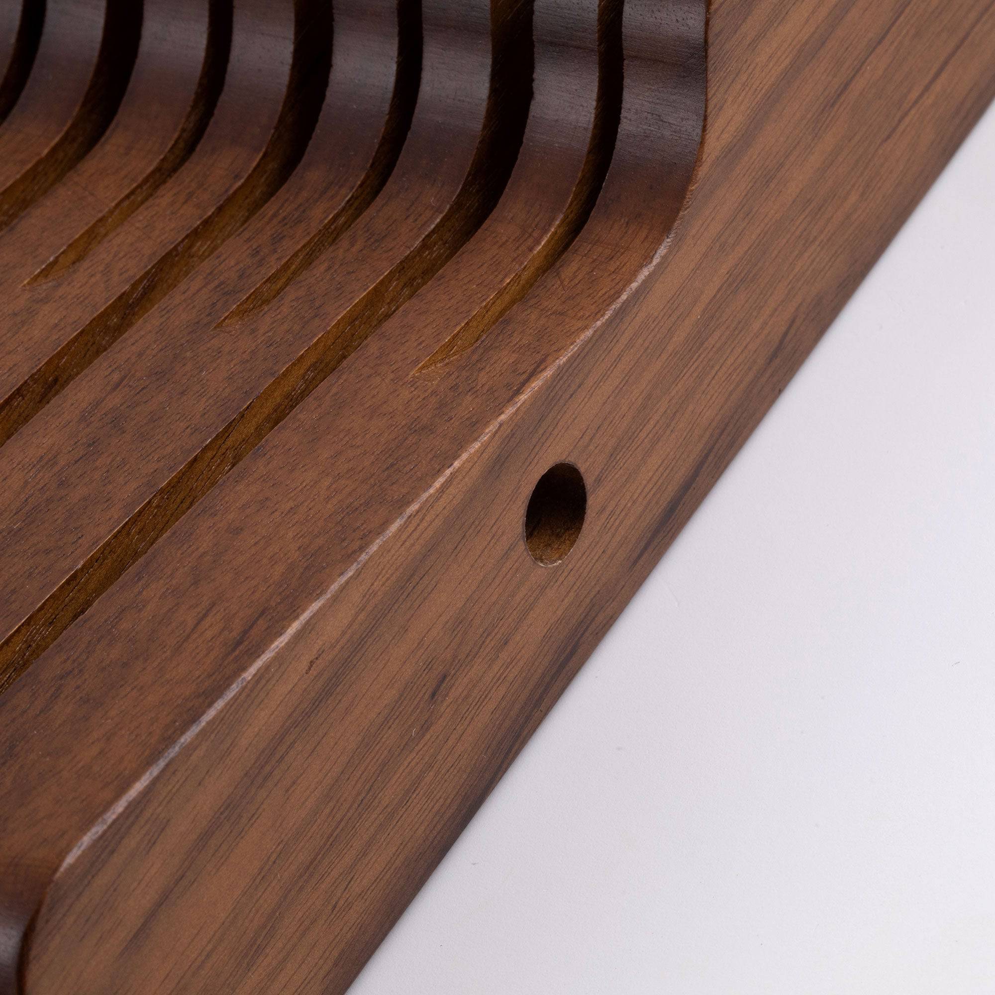 Messermeister 11 Slot Contemporary Acacia In-Drawer Knife Holder shows a close up of the side of the holder and the connecting locations for multiple holders.